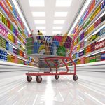 Full Shopping Cart Whizzing through Colorful Aisle