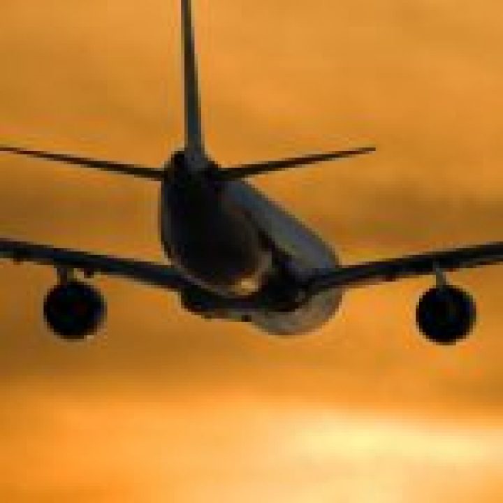 CustomerCareMC_Industries_Travel Airplane In Flight In Yellow Sky